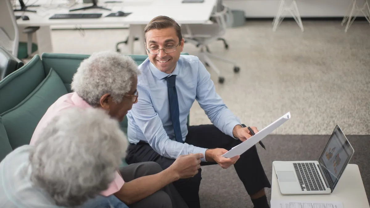 Licensed advisor explaining government debt help programs to a client during a free consultation